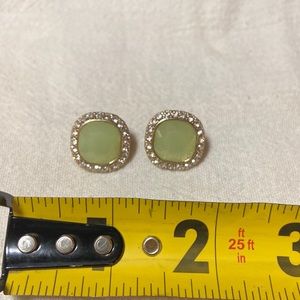 Gold earrings with light jade-type stone